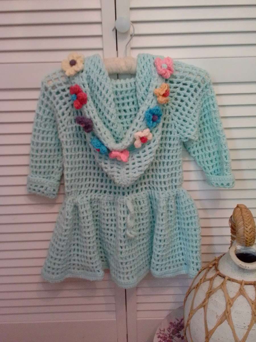 crocheted hoodie with puff flowers and heart wood buttons