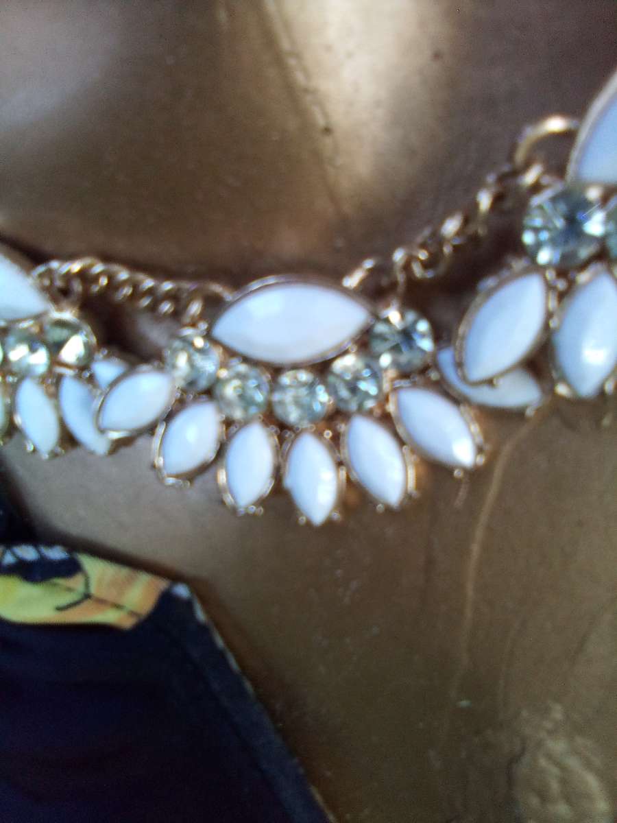 dangling White stoned gold necklace