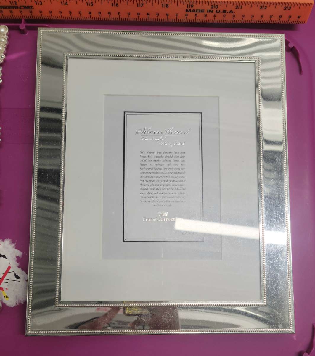 2  8x10 Photo Frames 1 Pearl and Embellished 1 Silver Mirror
