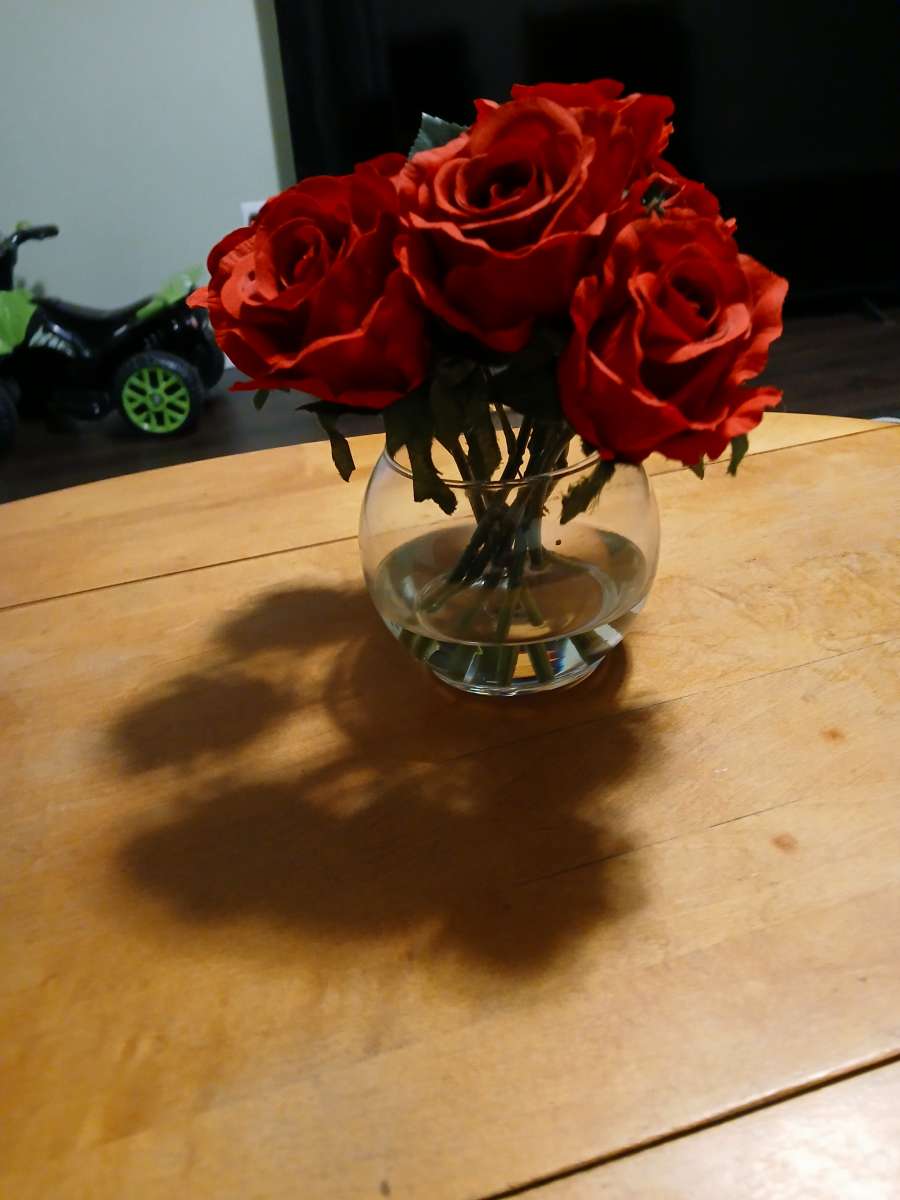 red roses in glass vase