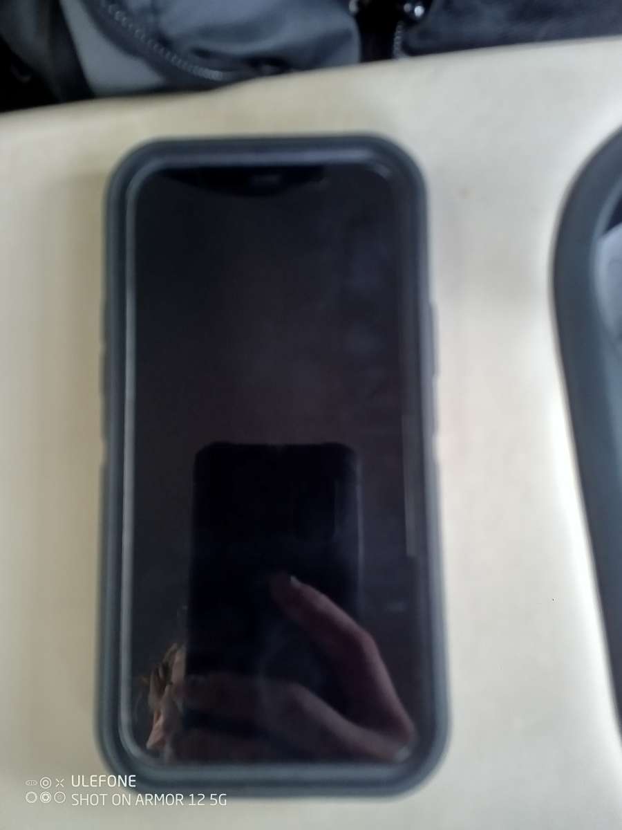Black iPhone 12 With Black OtterBox Case