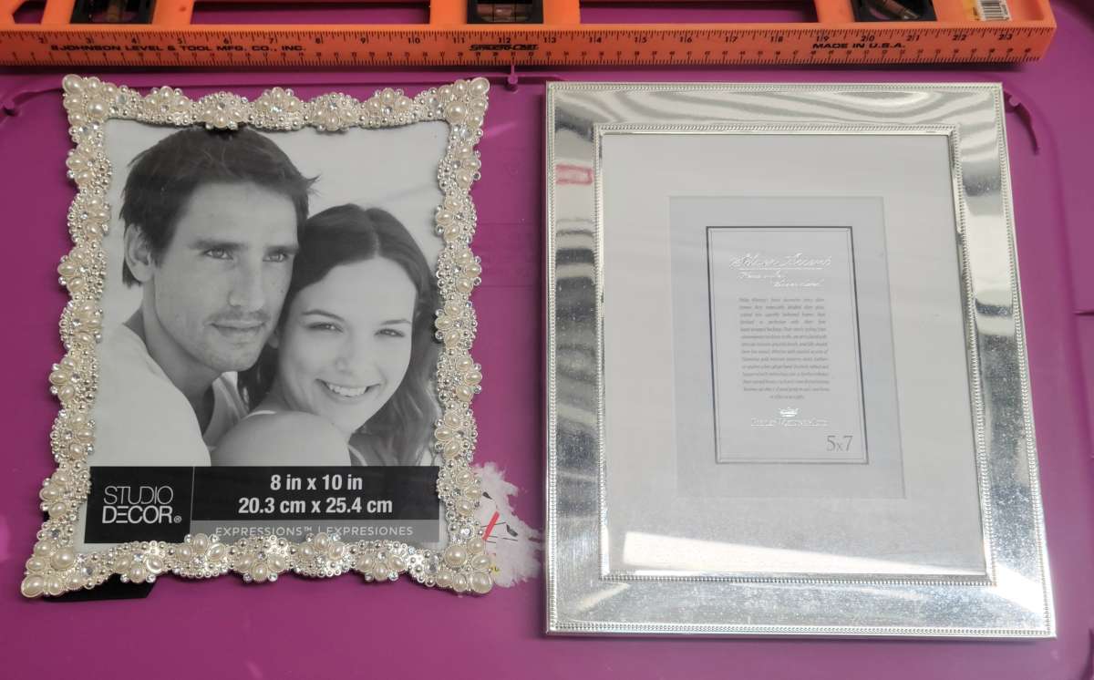 2  8x10 Photo Frames 1 Pearl and Embellished 1 Silver Mirror