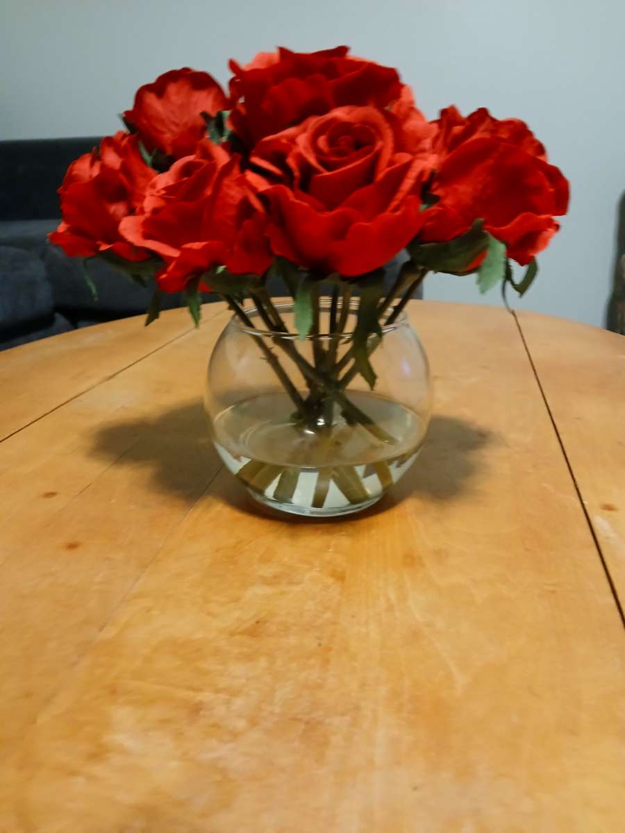 red roses in glass vase