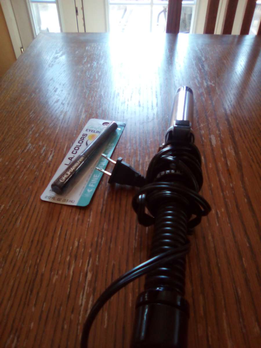 curling iron and eyeliner brand new