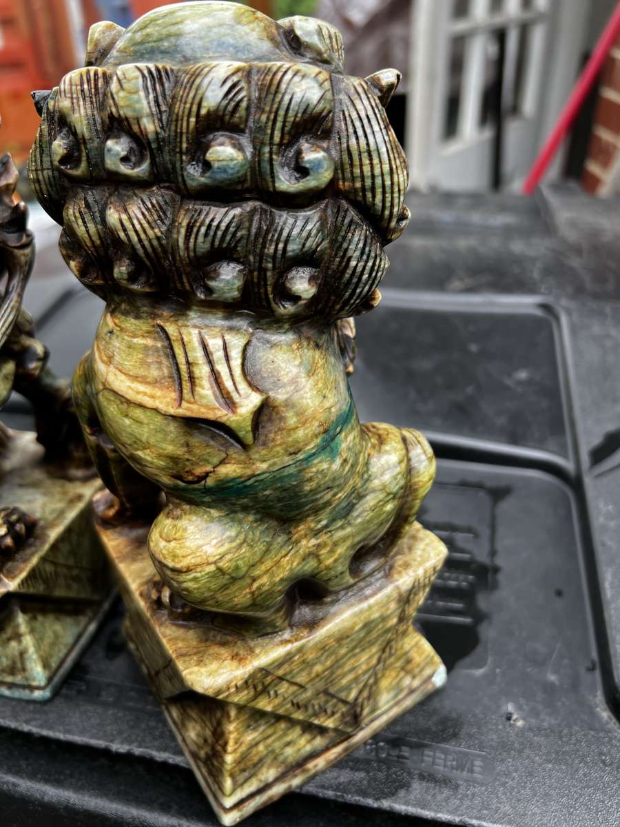two hand carved statues