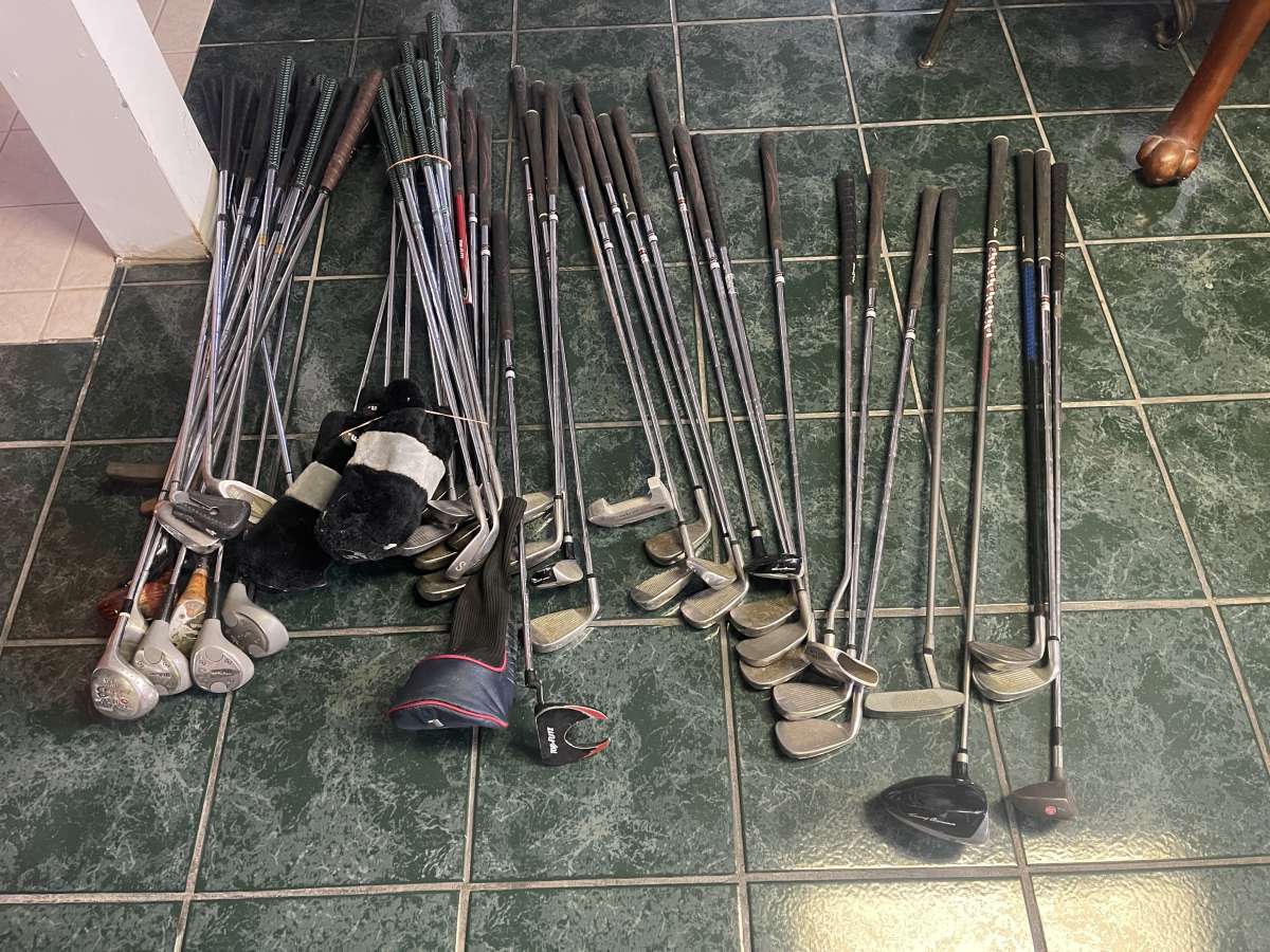 huge lot of golf clubs