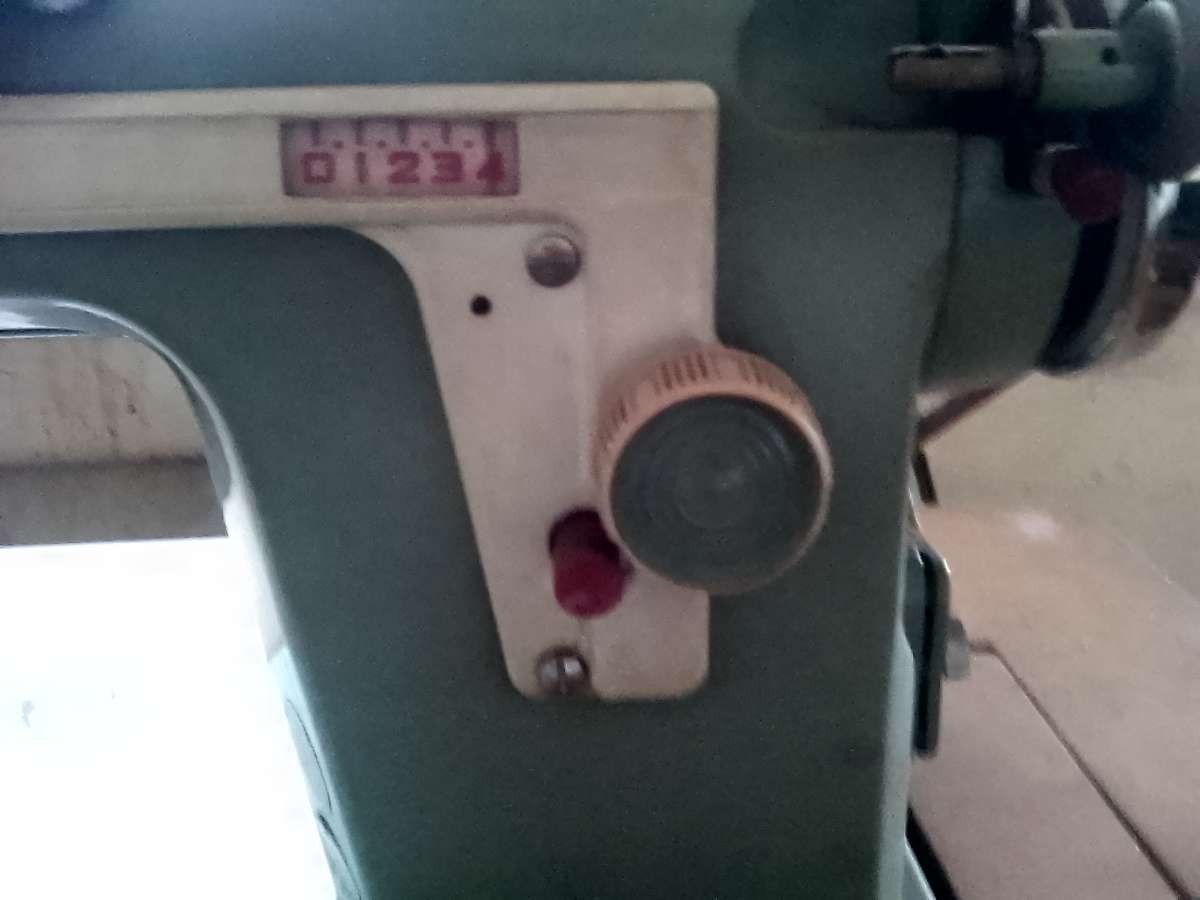 janome sewing machine in cabinet