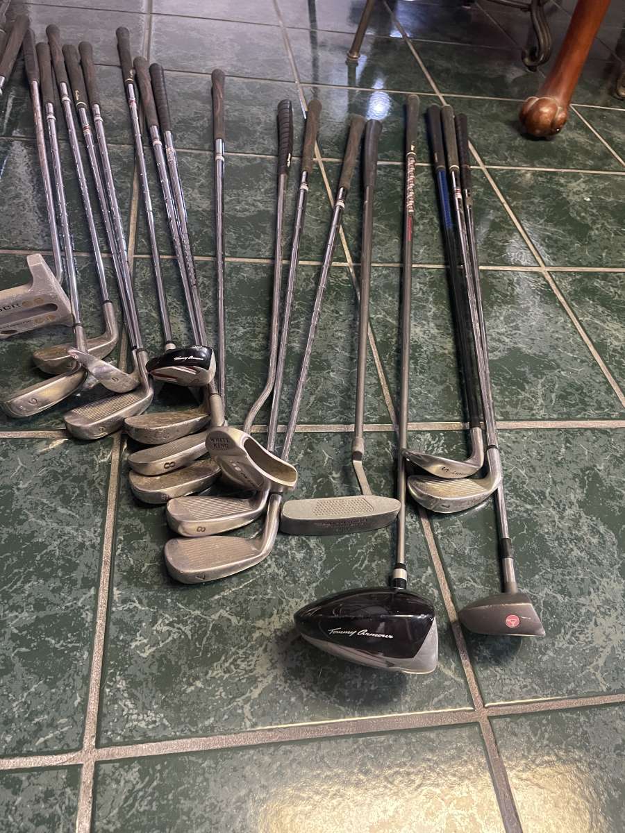 huge lot of golf clubs