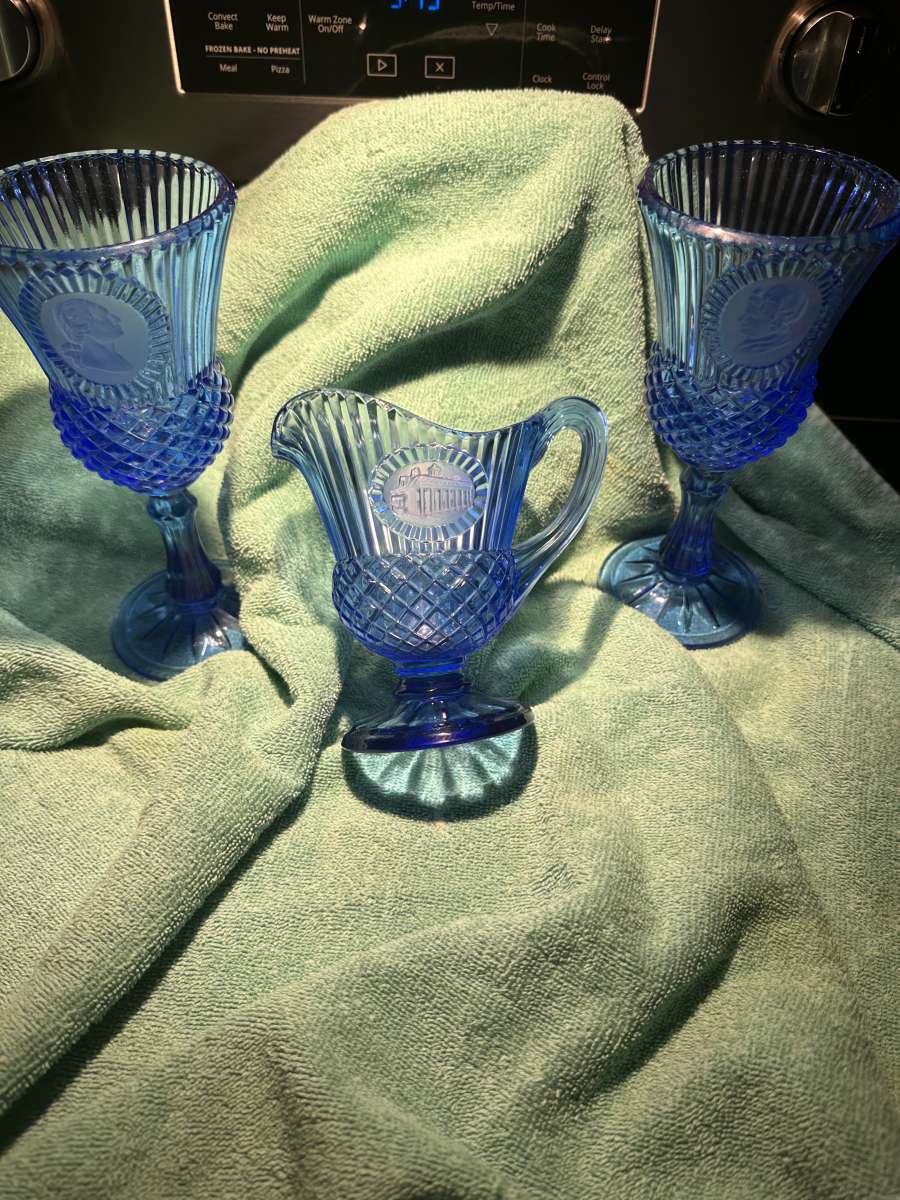 blue glass goblets and pitcher