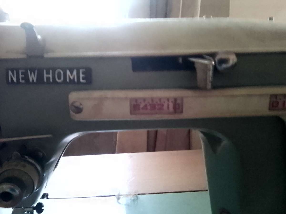 janome sewing machine in cabinet