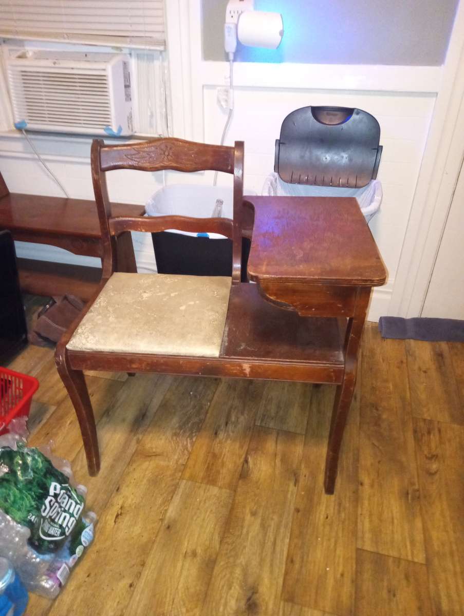 Antique phone table with old phone and rotary phone