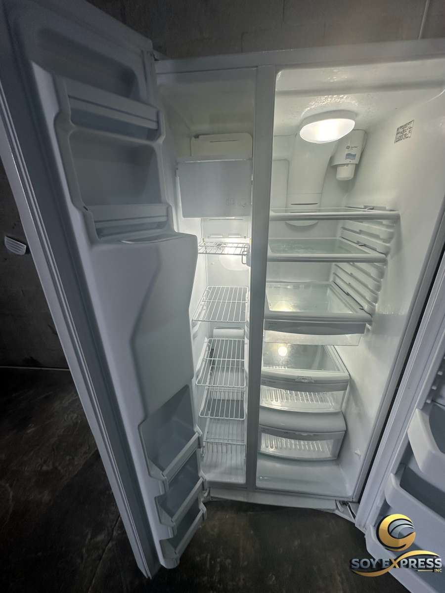 GE refrigerator side by side with ice and water dispenser