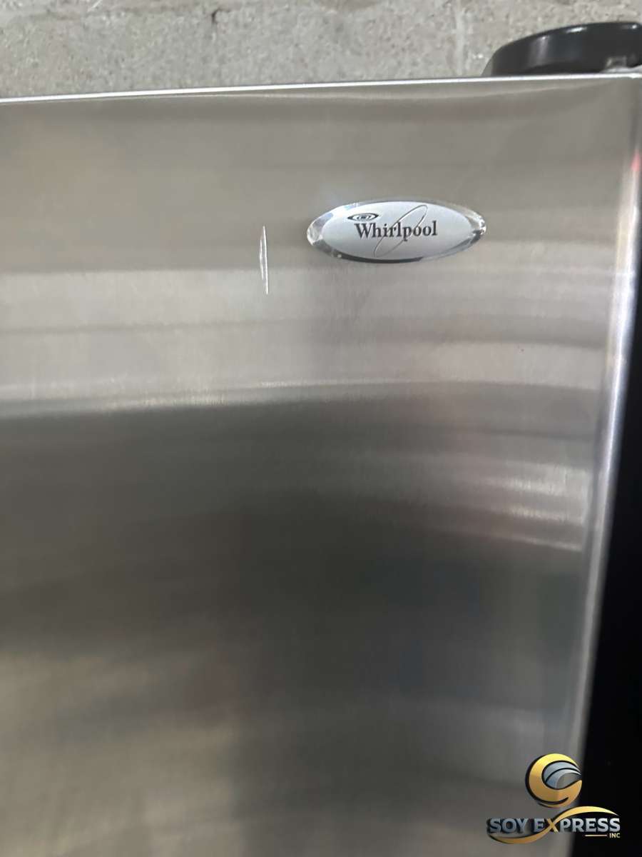 GE refrigerator side by side with water and ice maker dispen