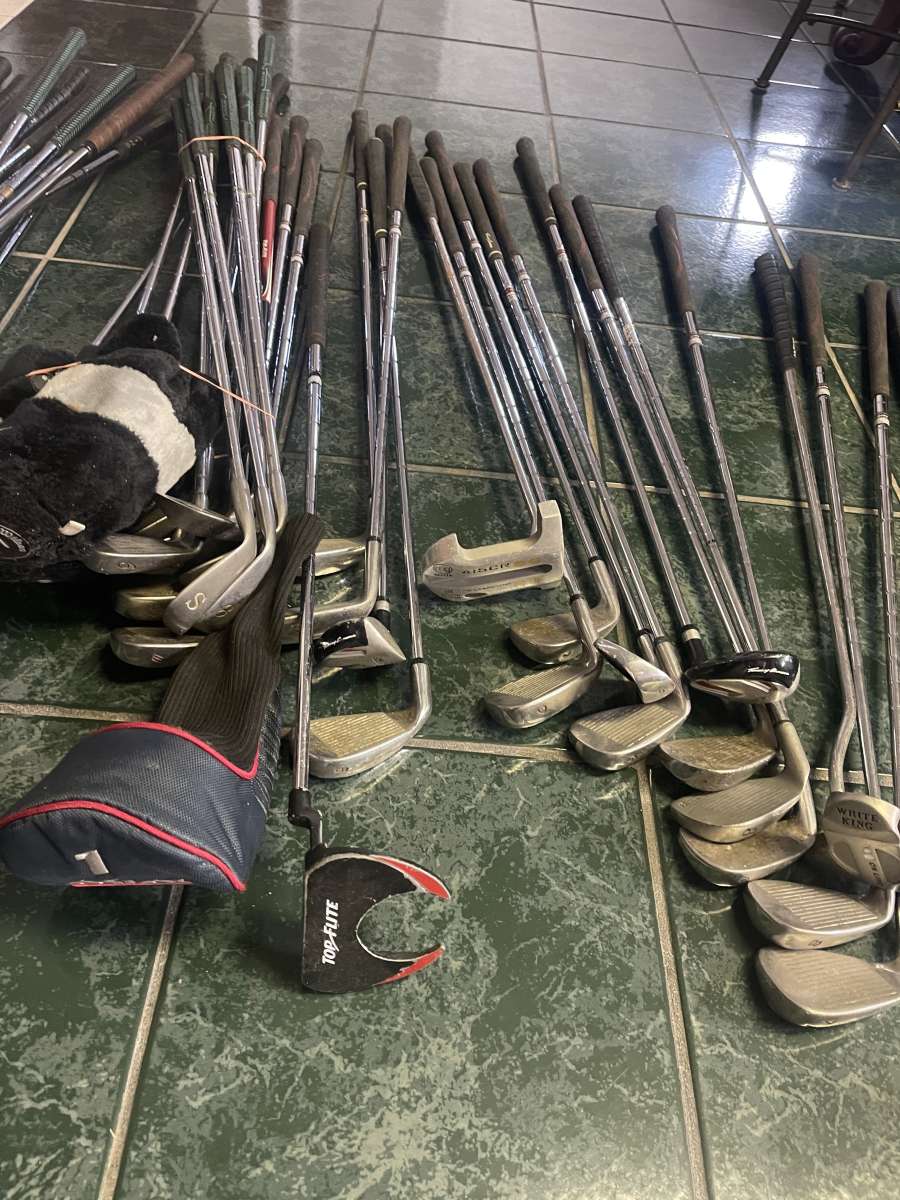 huge lot of golf clubs