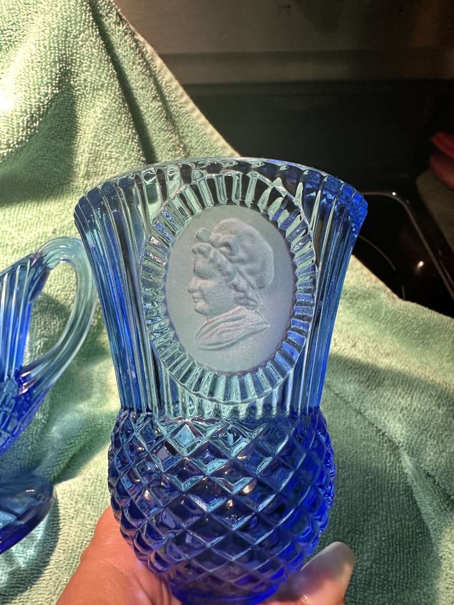 blue glass goblets and pitcher