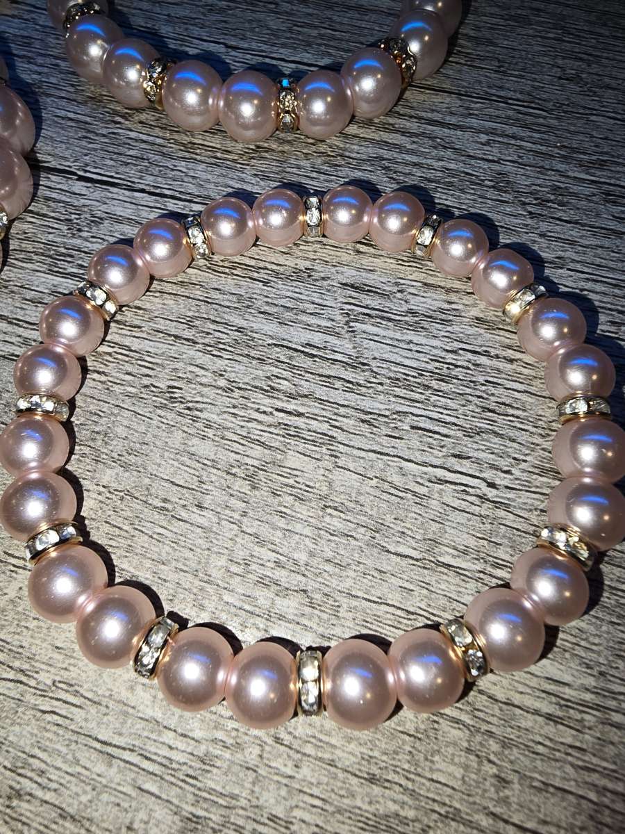 Brand New never worn set of 4 pink pearl Bracelets