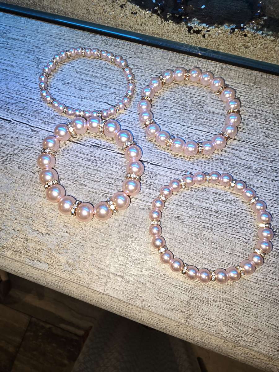 Brand New never worn set of 4 pink pearl Bracelets