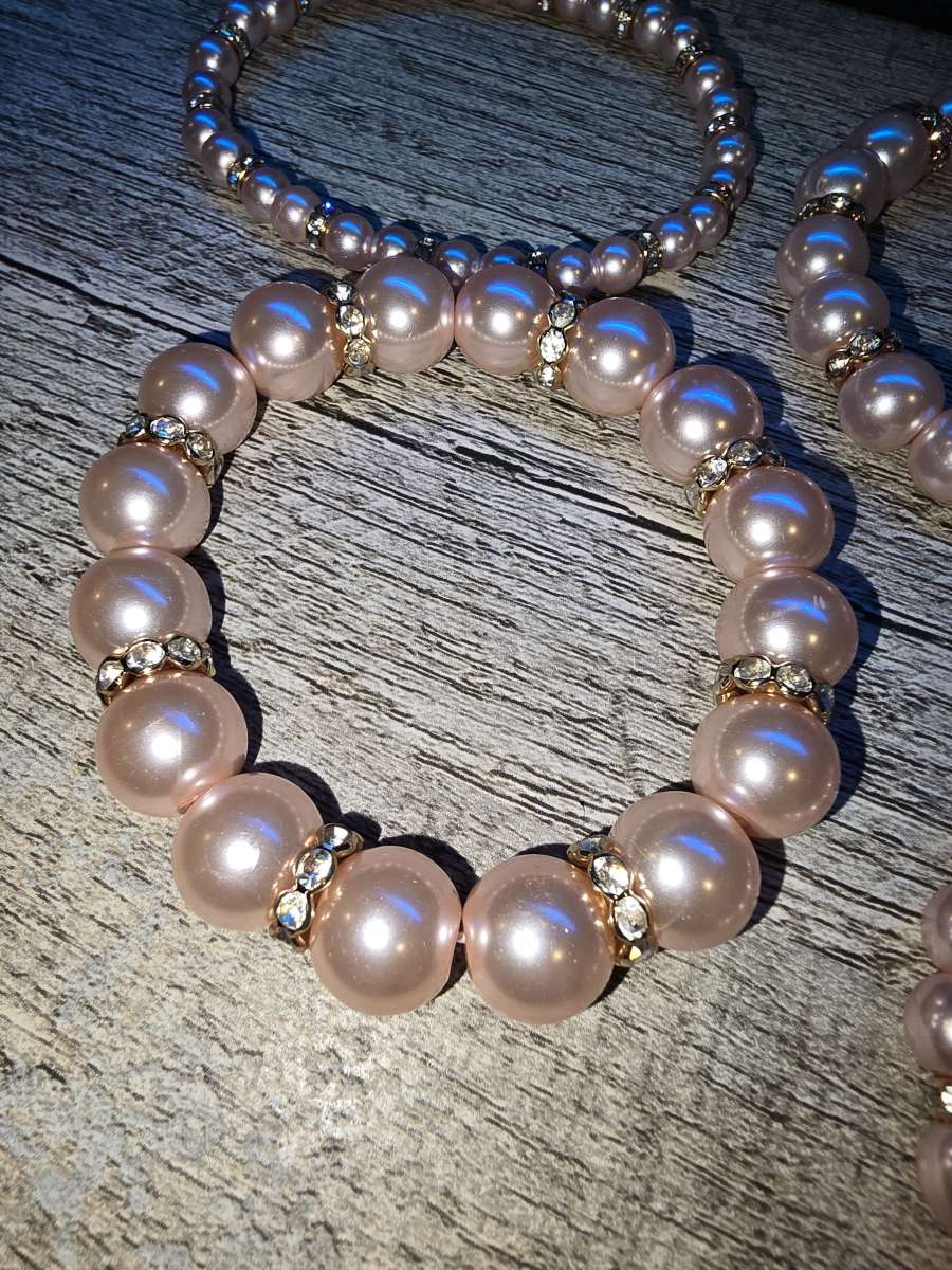 Brand New never worn set of 4 pink pearl Bracelets