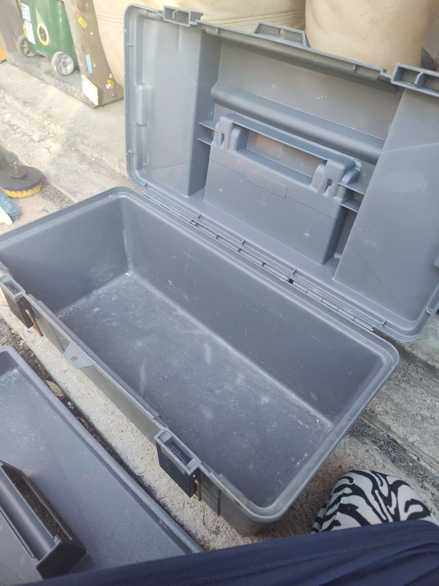 tool box with cleaning scrubbers and a drill
