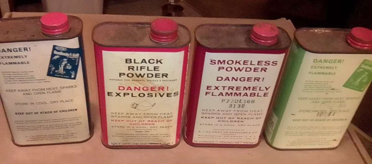 collection of gunpowder tins