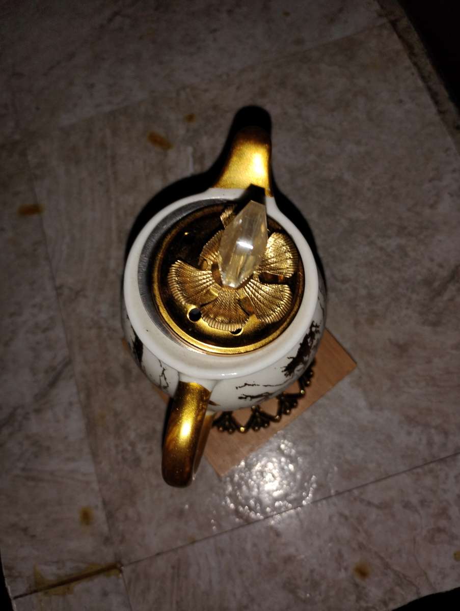 gold and white teacup