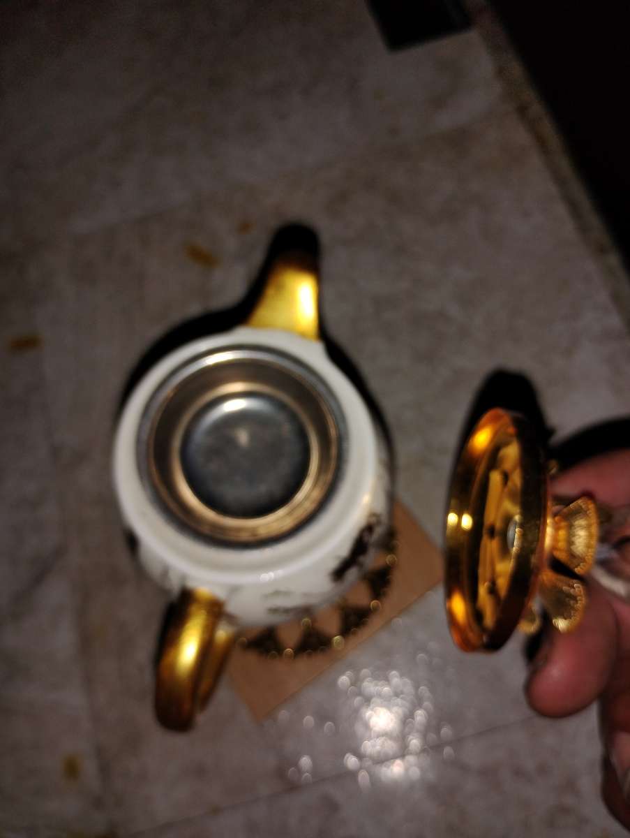 gold and white teacup