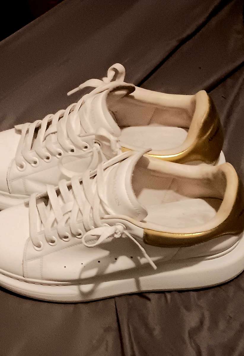 a pair of Alexander McQueen sneakers  size 9