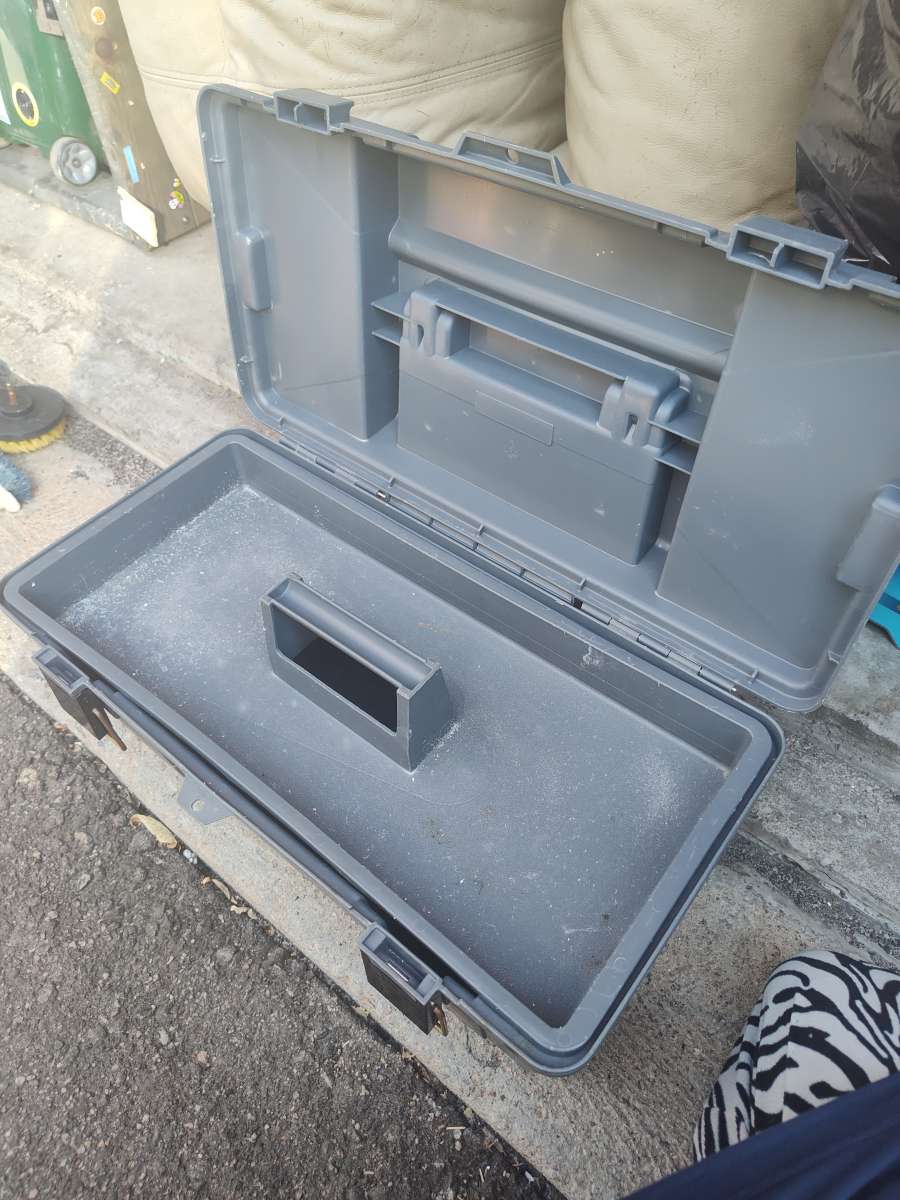 tool box with cleaning scrubbers and a drill