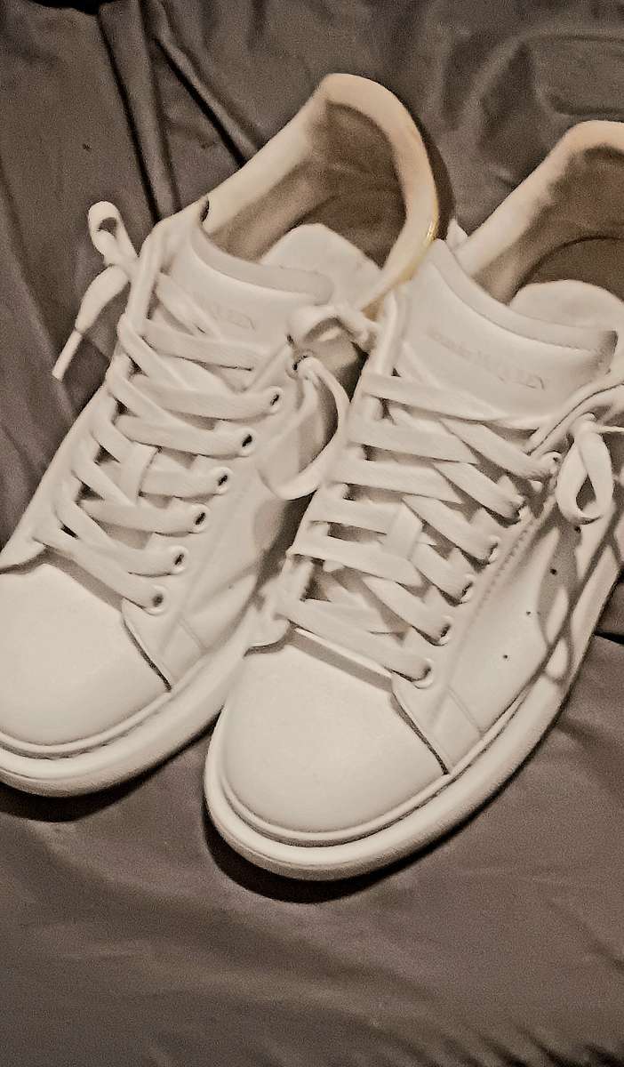 a pair of Alexander McQueen sneakers  size 9