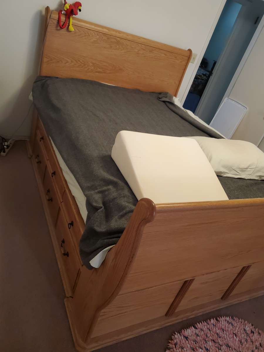 Solid oak queen sleigh platform bed with 12 drawers
