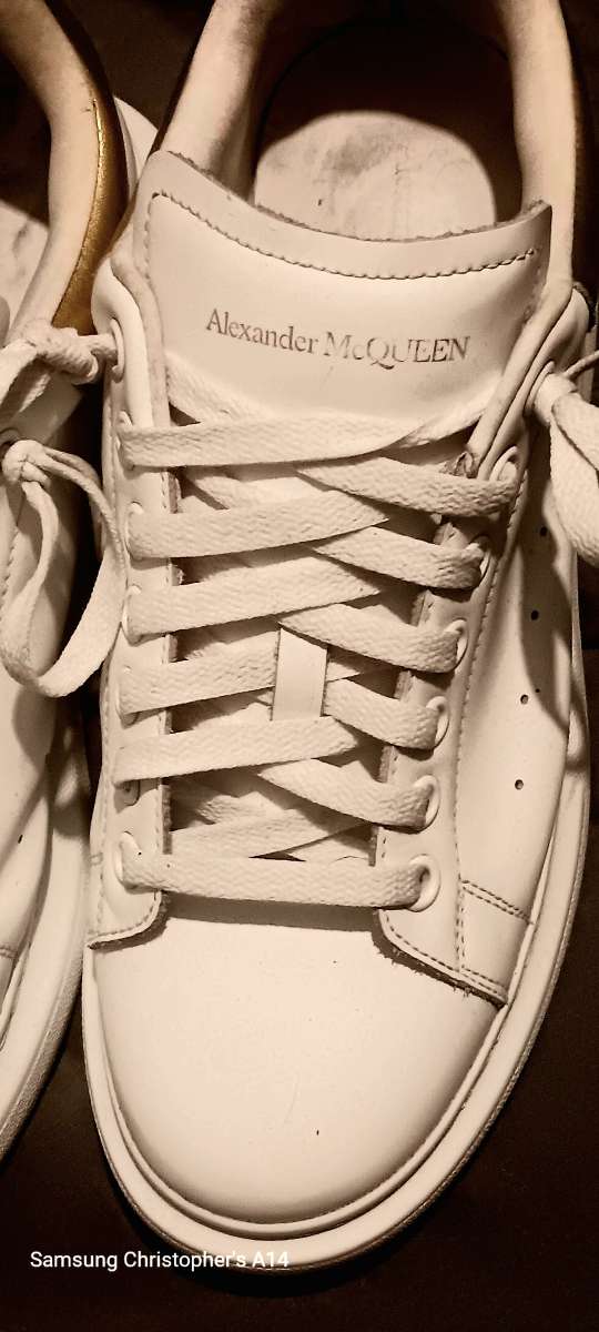a pair of Alexander McQueen sneakers  size 9