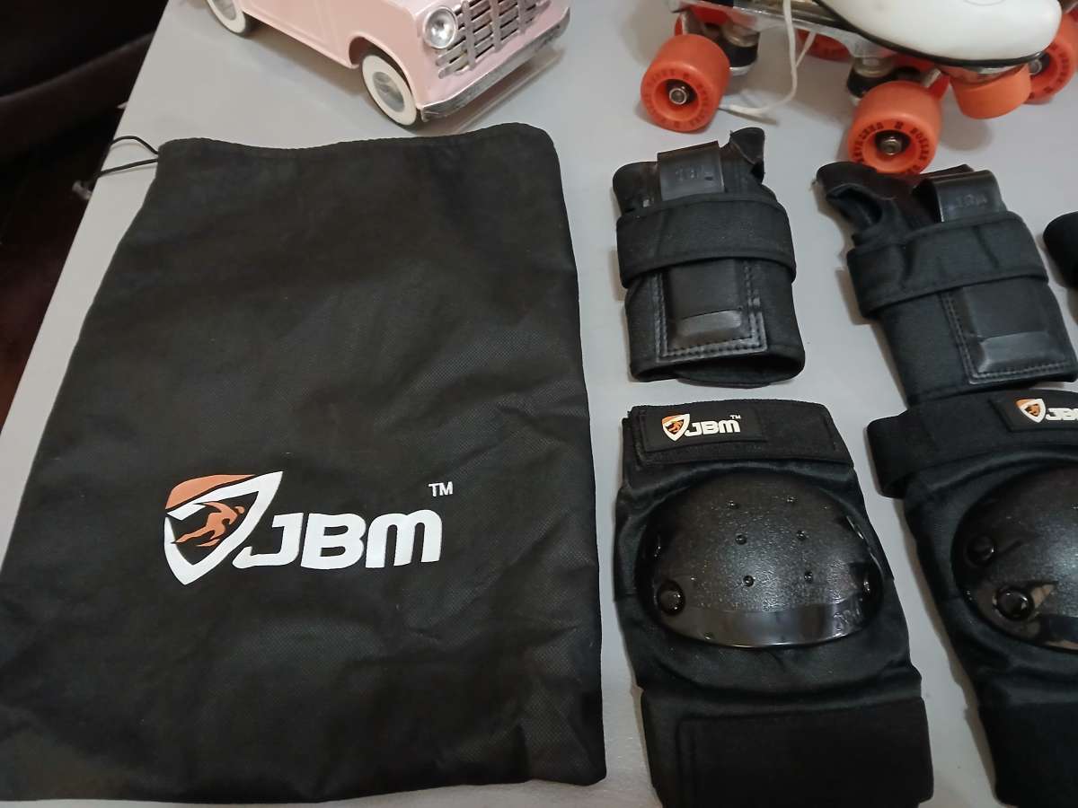 Roller Derby classic roller skates with pads and guards