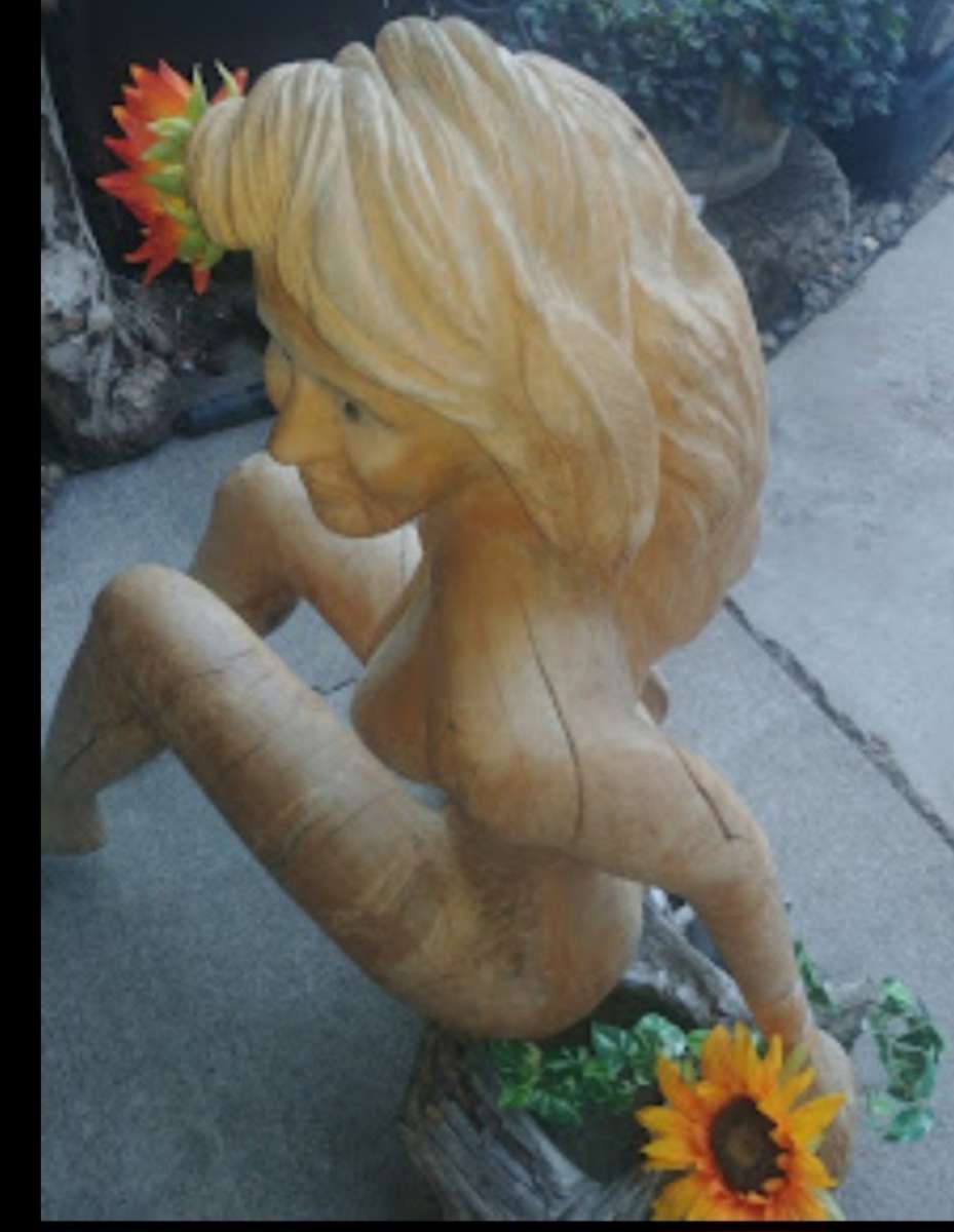 lifesize hand  chainsaw wood woman