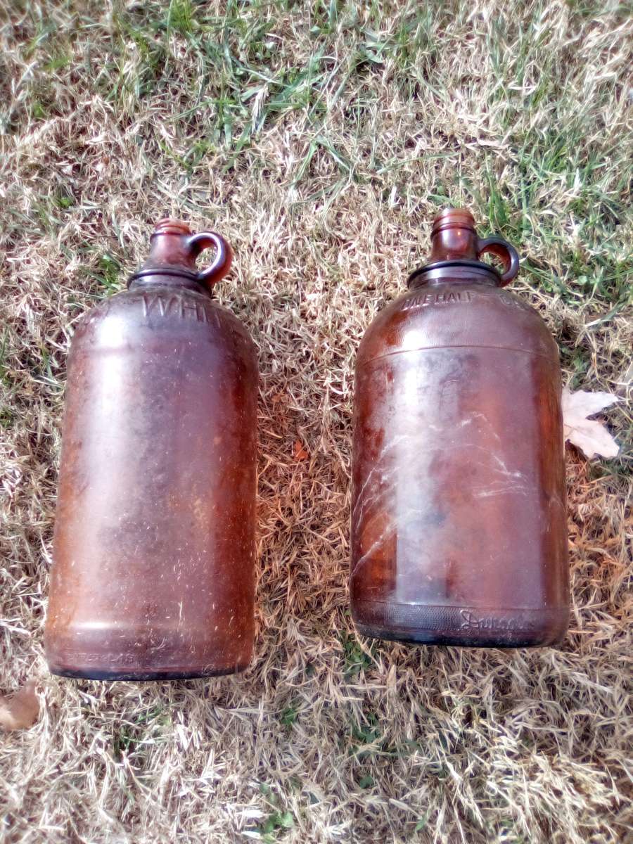 two vintage bleach jugs