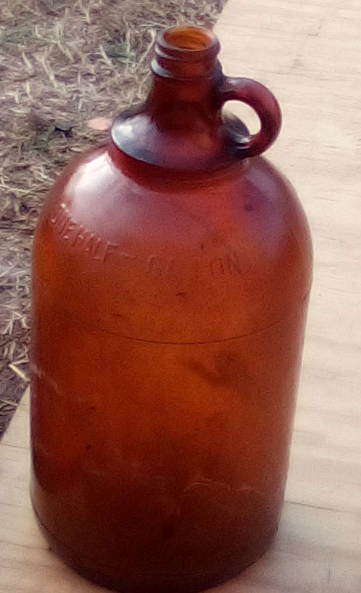 two vintage bleach jugs