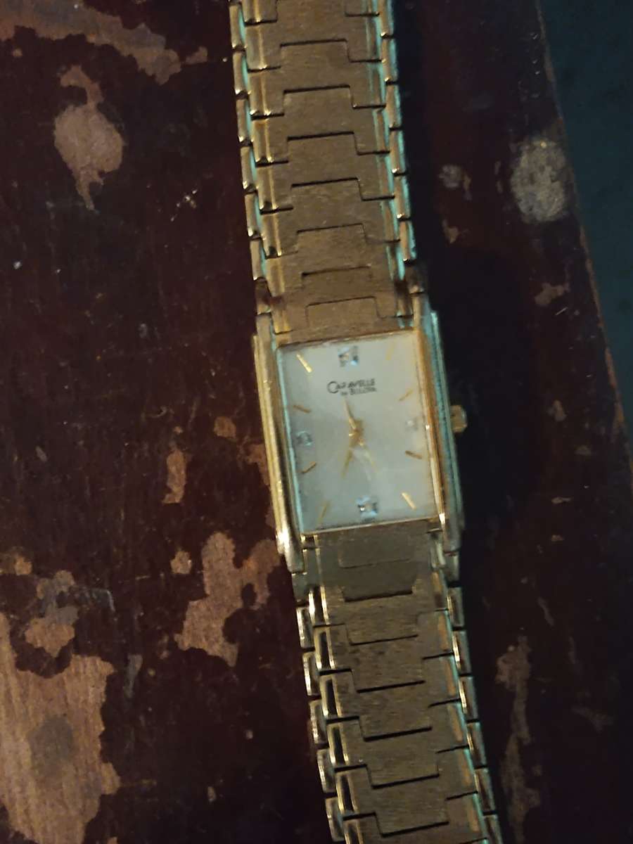 gold Bulova watch