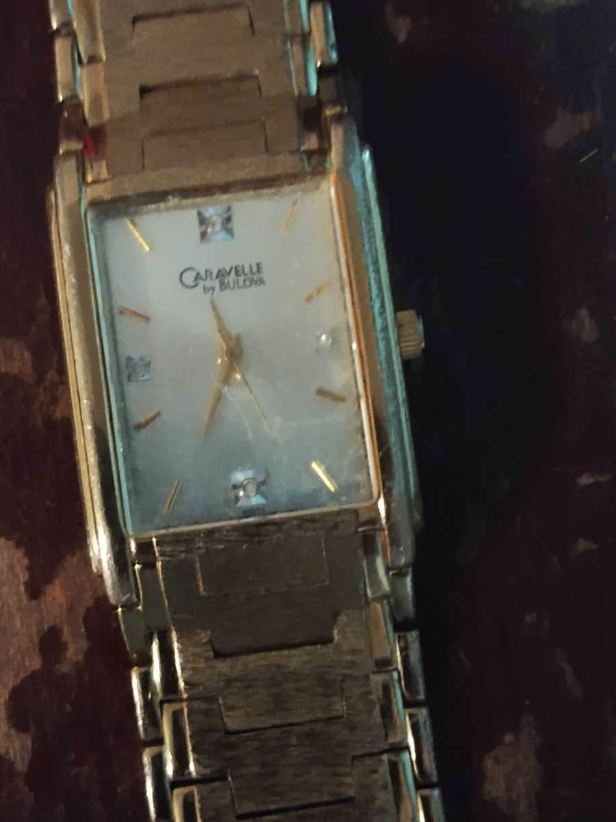 gold Bulova watch