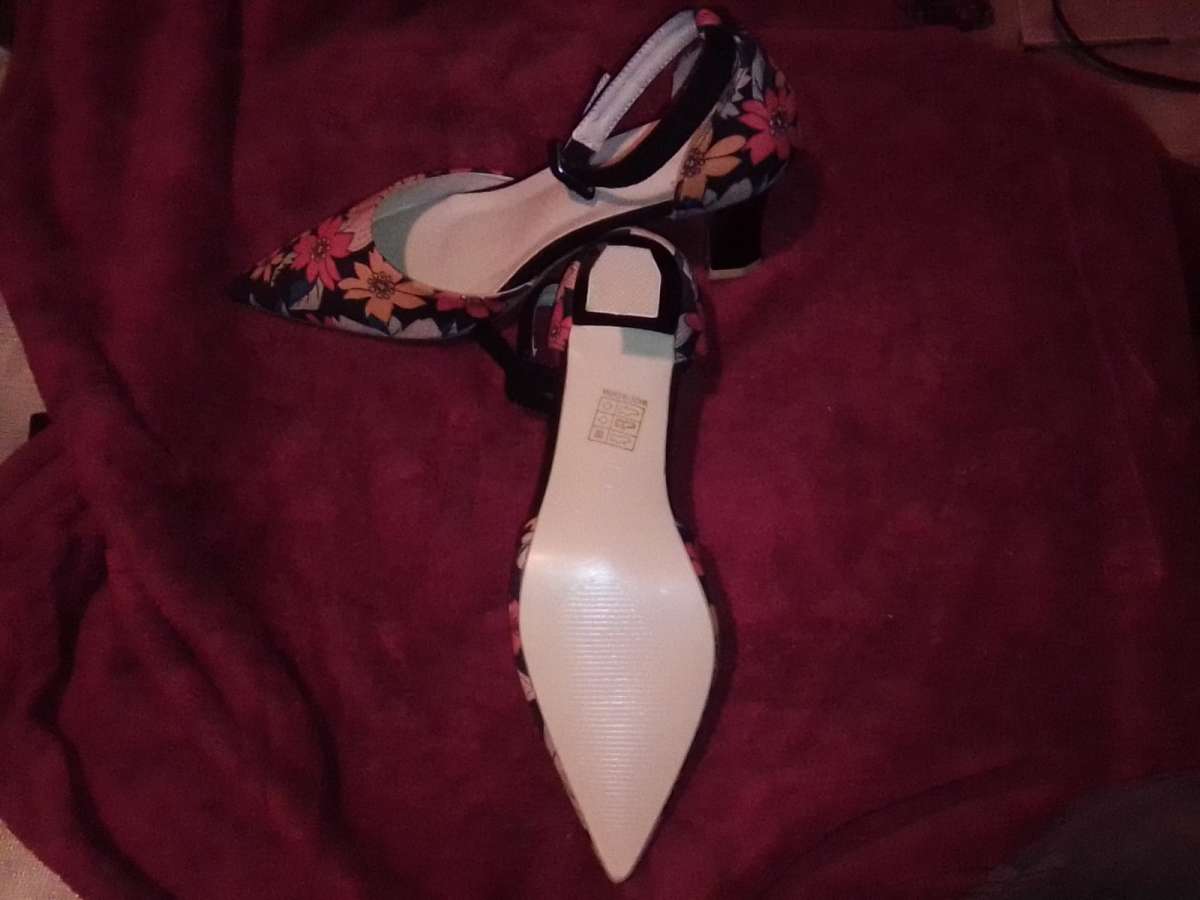 floral hells never worn