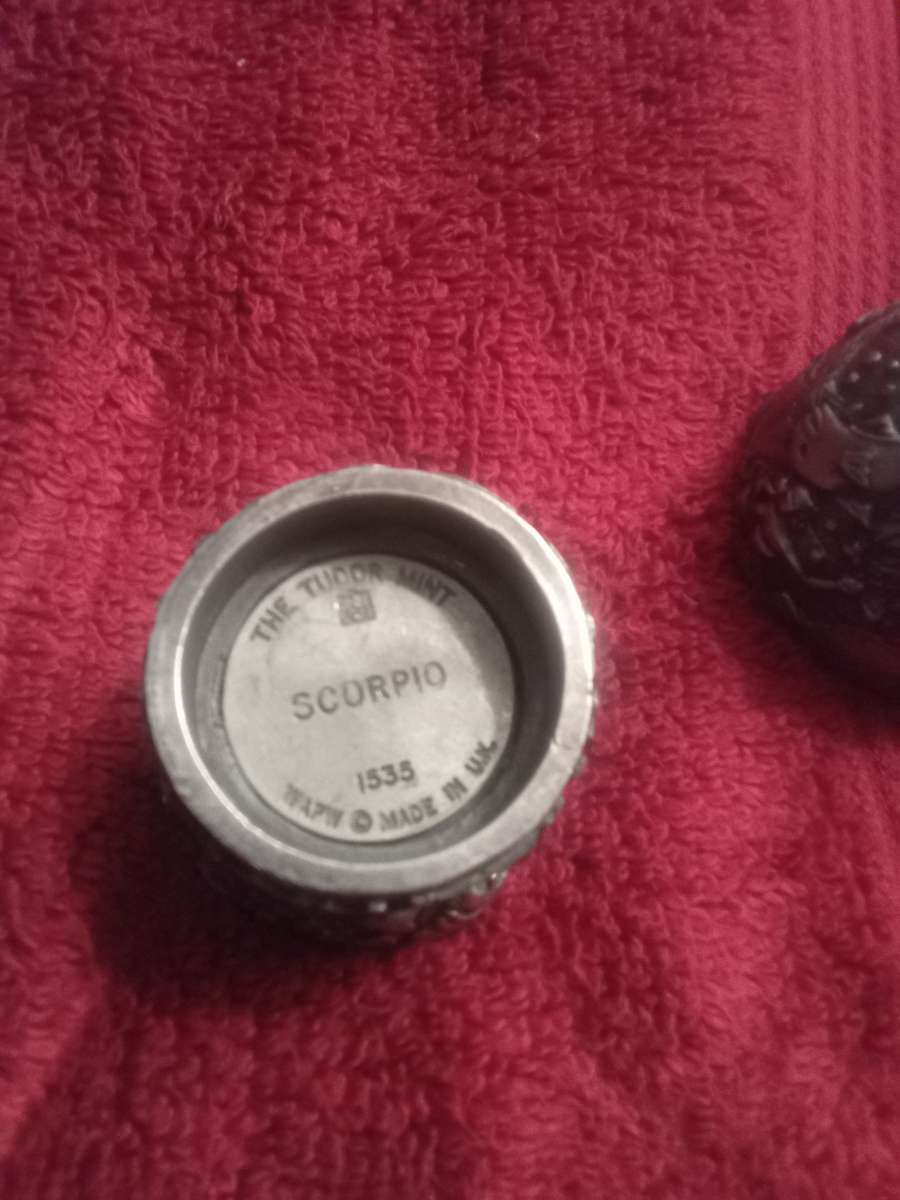 antique silver egg with horoscope signs