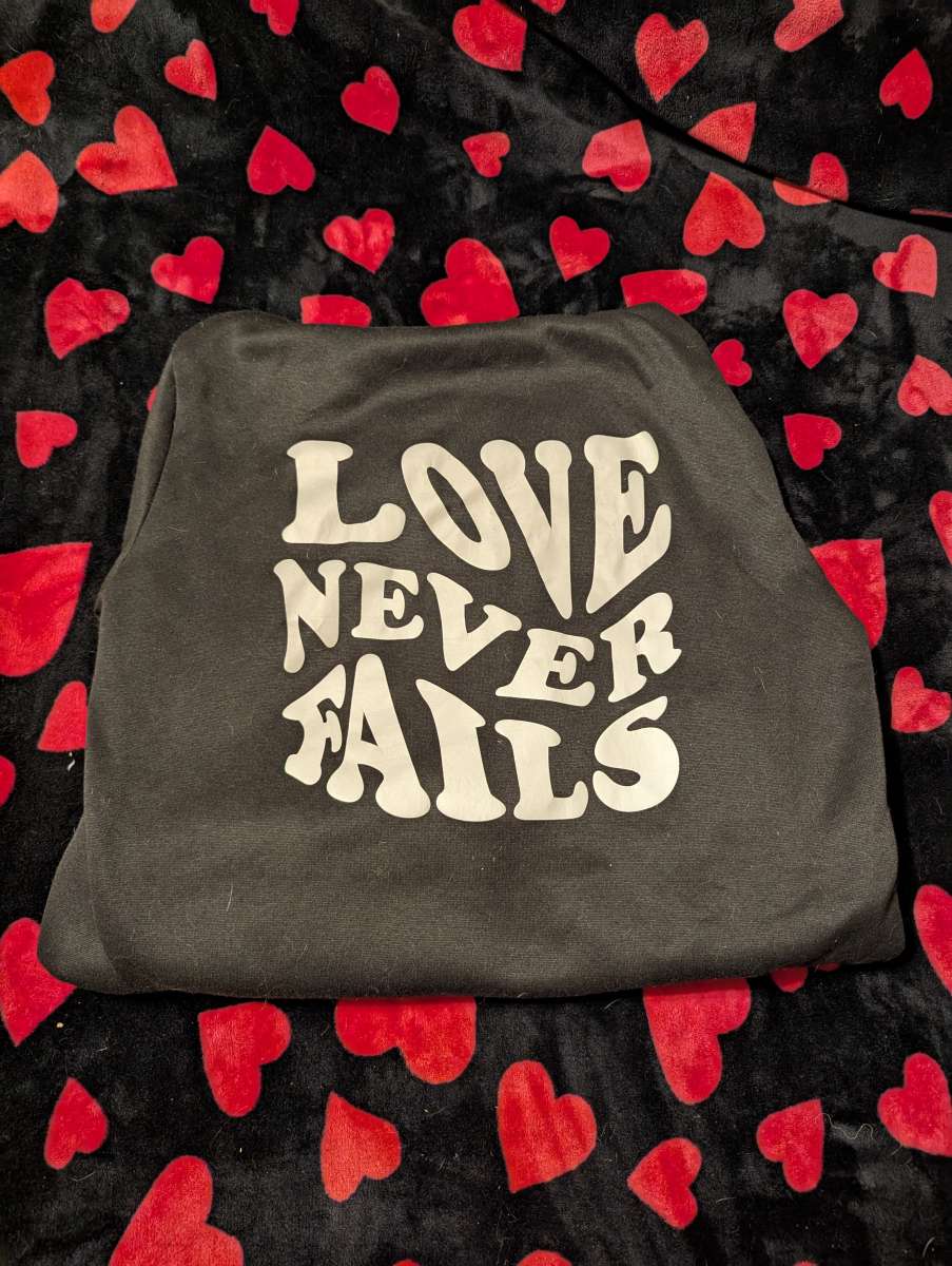 Love Never Fails Hoodie