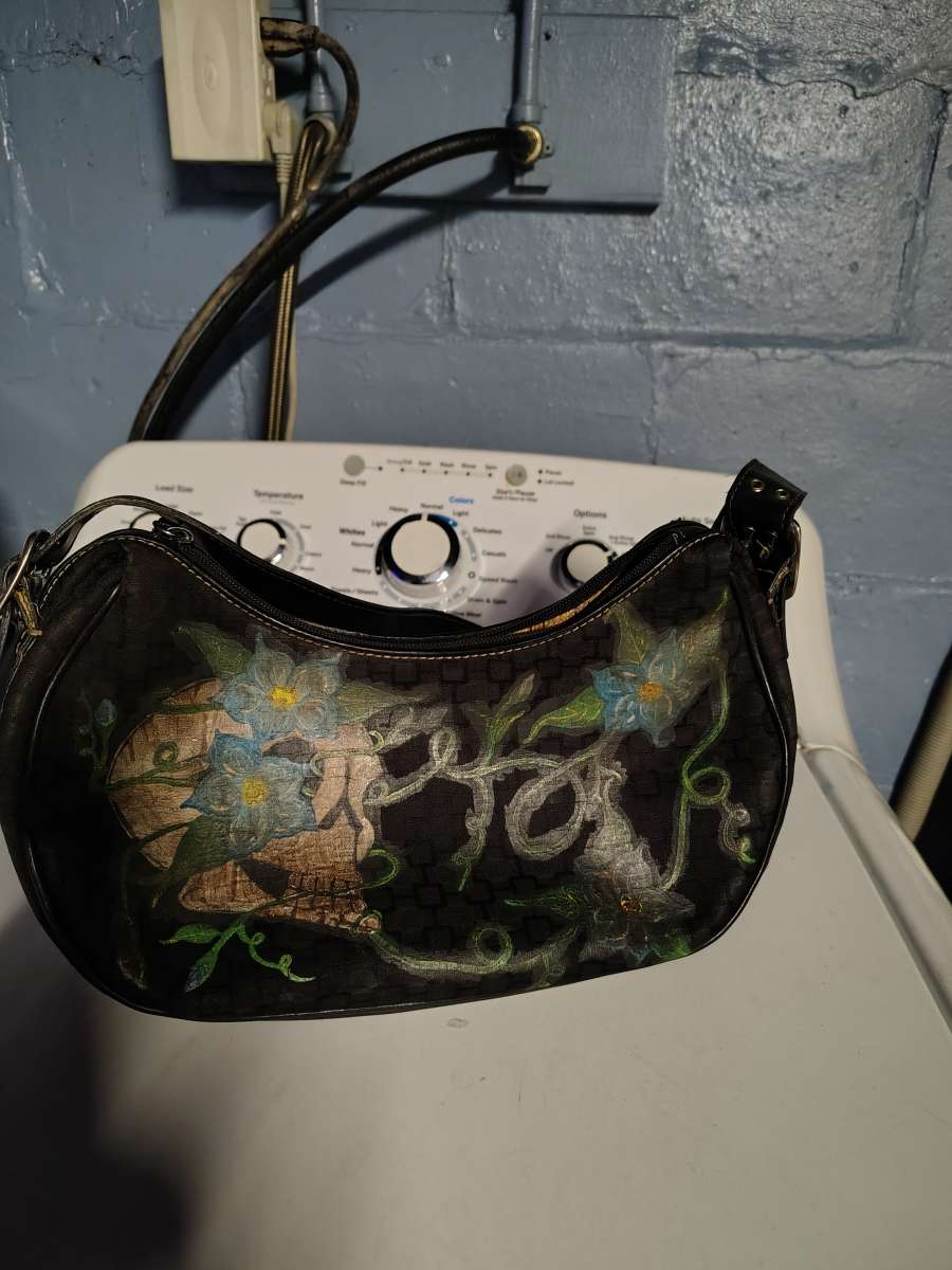 a black small purse Mine West