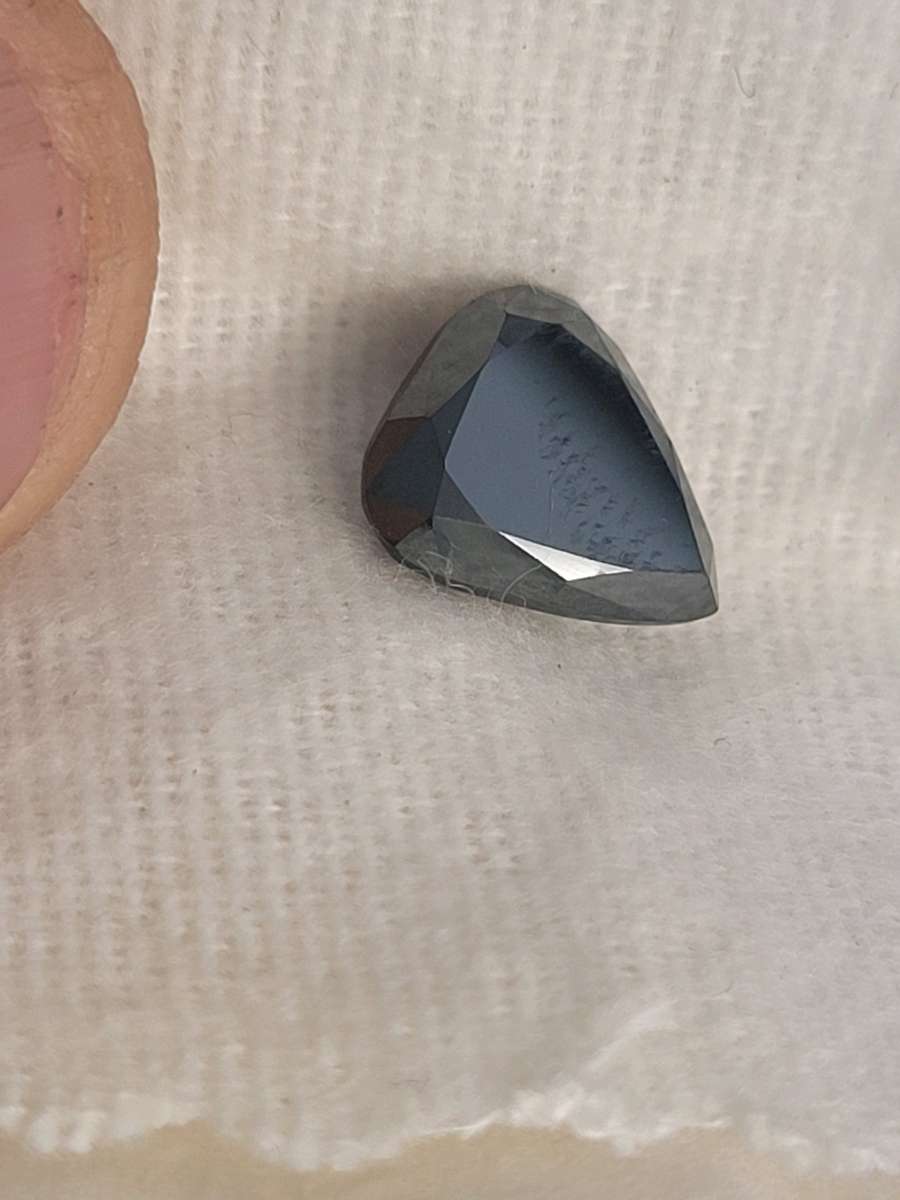 a nicely cut pearshaped black diamond
