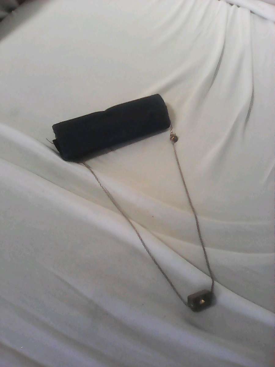 silver girl and woman necklace needs cleaning