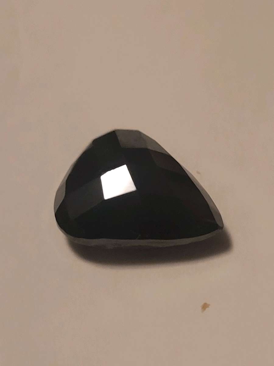 a nicely cut pearshaped black diamond