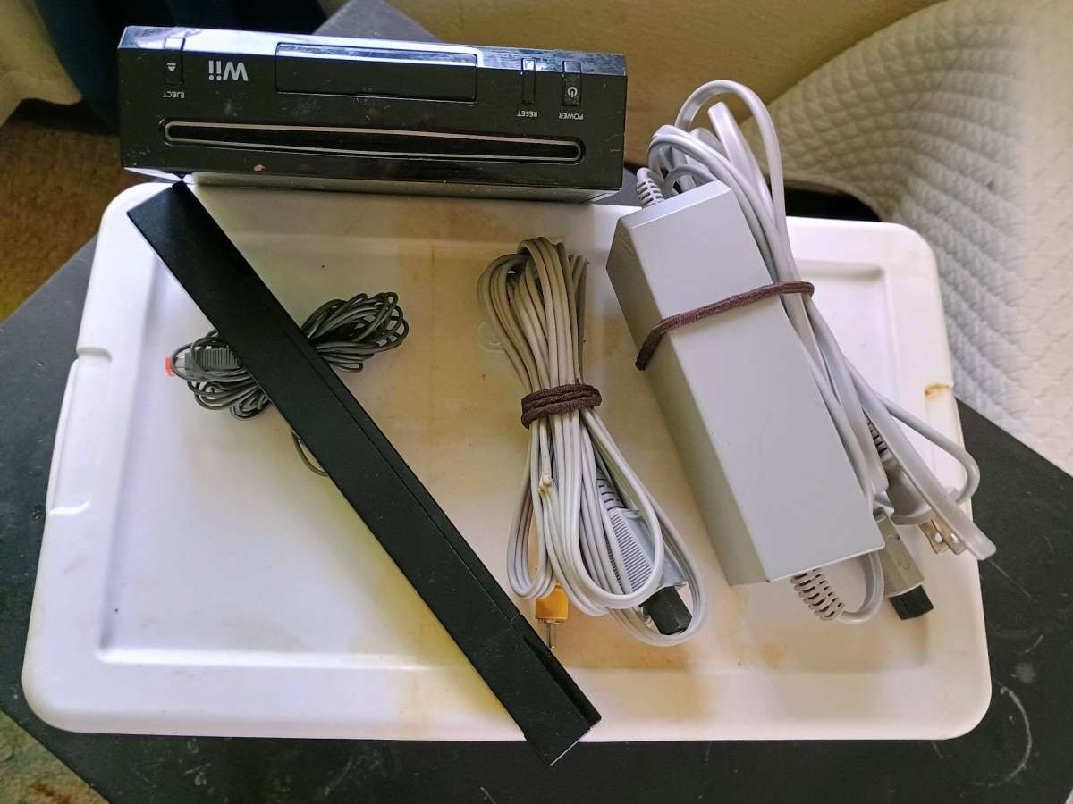 Nintendo WII w cords  and he sensor bar