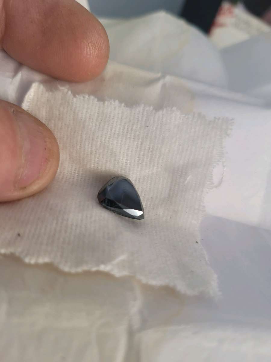a nicely cut pearshaped black diamond