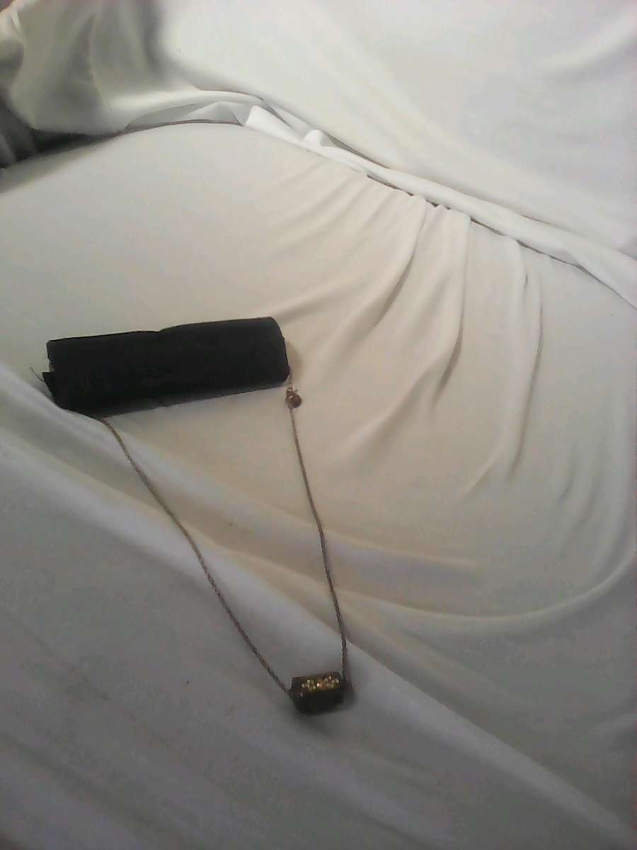 silver girl and woman necklace needs cleaning