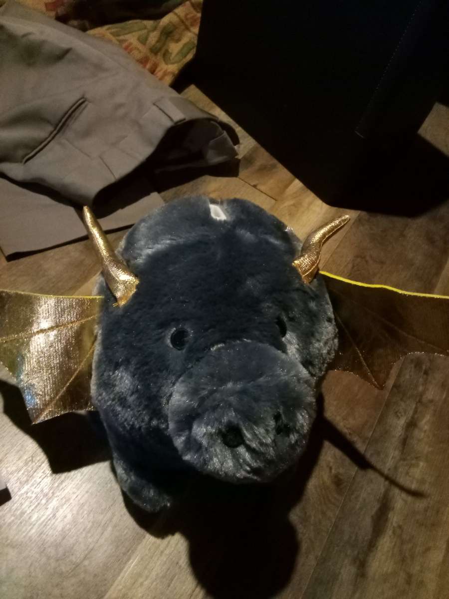 stuffed piggy bank with bat wings