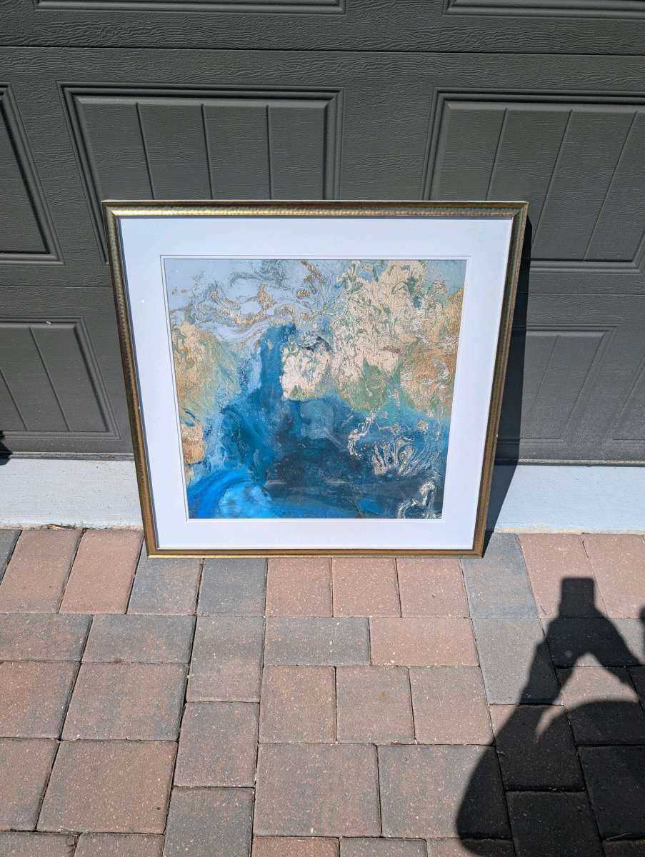 Pictures and coffee table and end table and wall art