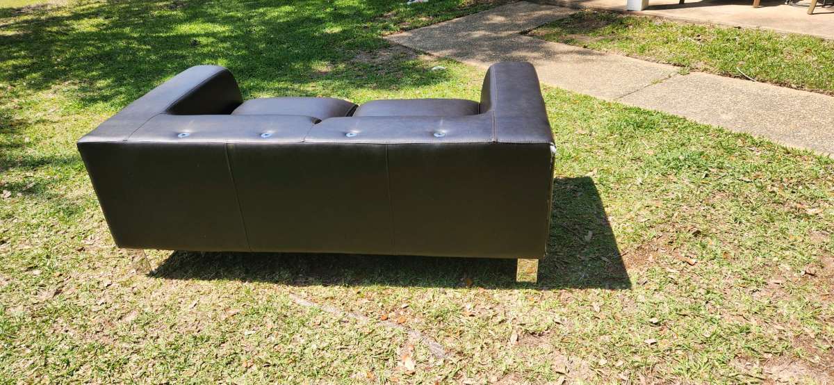 Black modern style leather couch very comfy cushions attache